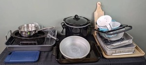 lot 65 image: Kitchen Items  Crock Pot, Wooden Mandolin, Roasting Pans, Glass and Metal Bakeware, Colanders, and More