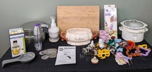 lot 66 image: Kitchen Items Small Kitchen Gourmet Crock Pot, Cookie Cutters, Wilton Cookie Press, Wilton Dessert Decorator, Spoon Rest, Cutting Board, Soup Tureen, Manual Chopper, and More