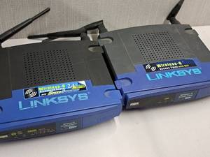 lot 690 image: Lot of (2) Linksys Routers - Wireless-G Broadband Router, Wireless-G Access Point