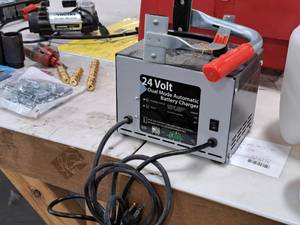 lot 437 image: Lester Electric 24V Dual Mode Automatic Battery Charger with Battery Carrier