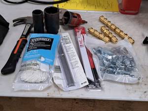 lot 439 image: Lot of (9) Hand Tools and Hardware - Claw Hammer, Hole Saws, Everbilt Nylon Cord, Milwaukee Sawzall Blades, Large Sockets, Plumb Line, Misc. Hardware