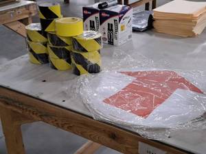 lot 583 image: (12) Rolls of CAUTION Tape and (5) Arrow Floor Decals 17D