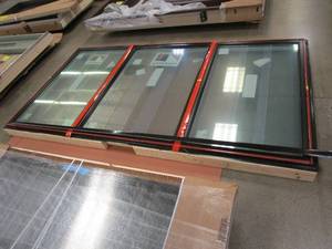 lot 6 image: Andersen 114 in x 59.5 in Dual Casement with Center Picture Window - Interior is White Vinyl - Exterior is Black Vinyl (MISSING CAM LOCK COVERS & CRANK COVERS AND HANDLES)
