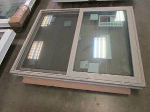 lot 53 image: Andersen 100 Series 51.5 in x 41.25 in Slider Window - Exterior Color Beige - Interior Color White Vinyl