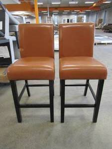 lot 84 image: Milan Faux Leather Counter Stools in Saddle Brown - Set of 2