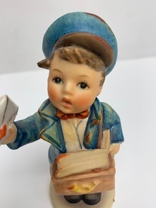 lot 12 image: Mk5 Postman Hummel Figurine