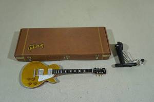 lot 105 image: Axe Heaven Gibson Les Paul Mini Guitar Gold