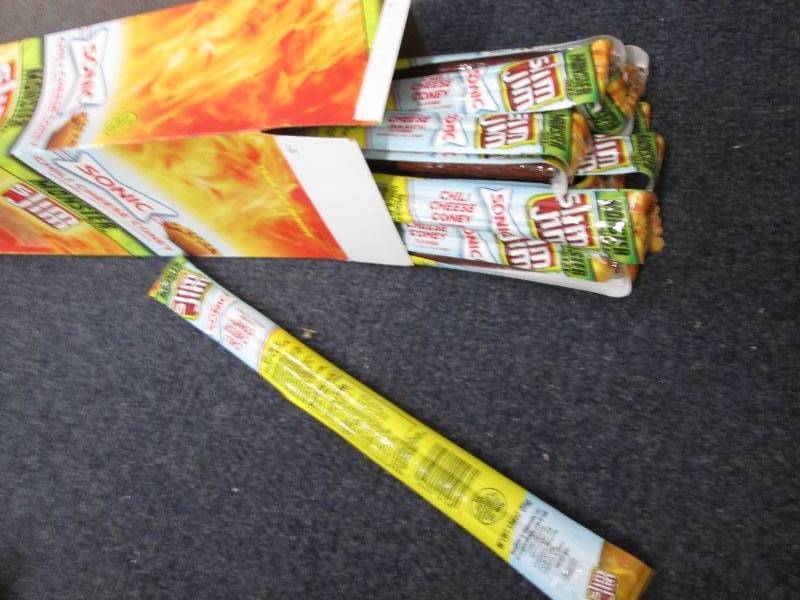 lot 425 image: Box of 18- 1.94 oz Slim Jim Monster...