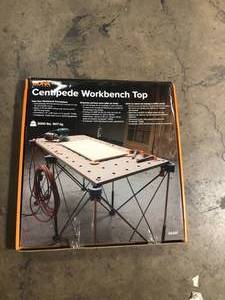 lot 31 image: BORA Centipede 24 in. x 48 in. Workbench Top for Sawhorse with 34 in. Dog Holes  Customer Returns See Pictures
