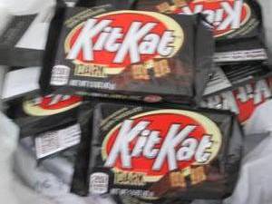 lot 214 image: 12 Dark KitKats...