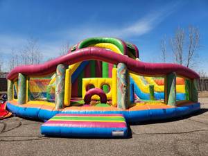 Inflatable Funland with 18 FT tall slide and HUGE bounce area Great Event piece