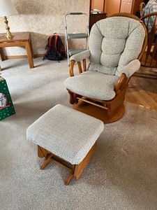 lot 73 image: wood swivel rocker and ottoman