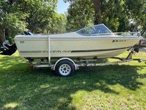 lot 23 image: 1982 Silverline Boat with Trailer and  85HP Mercury Outboard Motor