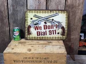 lot 49 image: We Dont Dial 911 Metal Sign