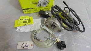 lot 66 image: RYOBI 4 in. Tile Saw Model # TC401 UPC Code #  033287164493