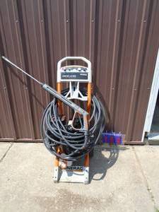 lot 104 image: Generac 2700 psi pressure washer with hose, wand & nozzles. Tested & works. As shown.