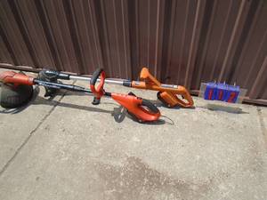 lot 112 image: Qty of 2 cordless trimmers with batteries & 1 charger. As shown.