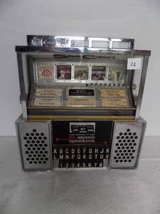 lot 12 image: Vintage Coin Operated 10-cent Booth Jute Box