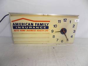 lot 91 image: Lit Hanging Clock - American Family