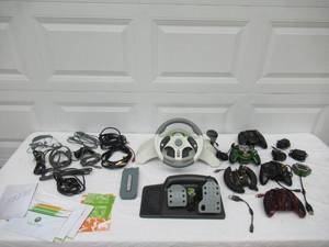 lot 65 image: NC2 Xbox with controllers, 360 manual and extras. Untested.