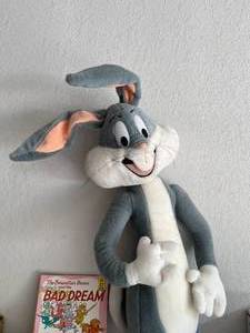 lot 101 image: Bugs Bunny Stuffed Toy and Lot of Kids Books