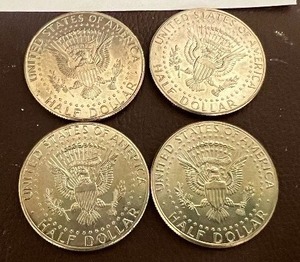 LOT OF 4 NIFC KENNEDY HALF DOLLARS