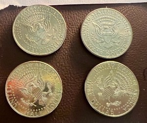 LOT OF 4 NIFC KENNEDY HALF DOLLARS
