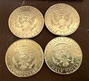 LOT OF 4 NIFC KENNEDY HALF DOLLARS