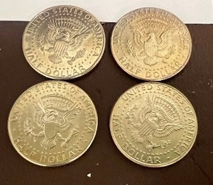 LOT OF 4 NIFC KENNEDY HALF DOLLARS