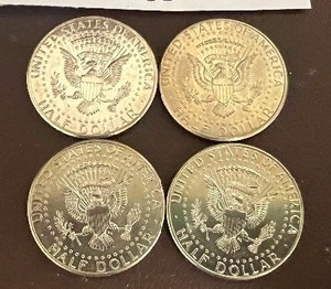 LOT OF 4 NIFC KENNEDY HALF DOLLARS