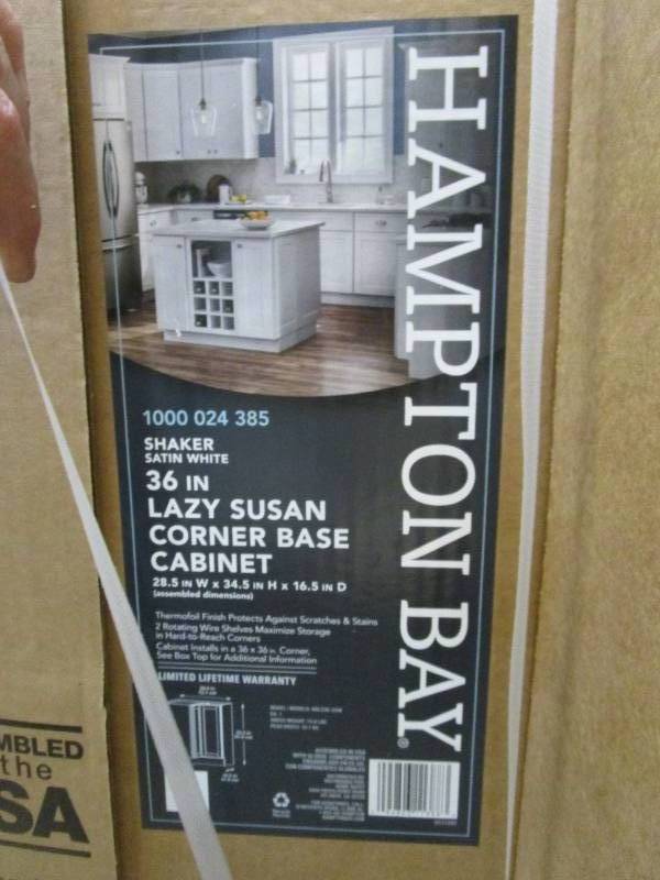 lot 587 image: Hampton Bay Shaker 28.5 in. W x 16.5 in. D x x 34.5 in. H in Satin White Assembled Lazy Susan Corner Base Kitchen Cabinet