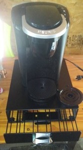 lot 97 image: Keurig Hot Beverage Maker with Pod Storage.