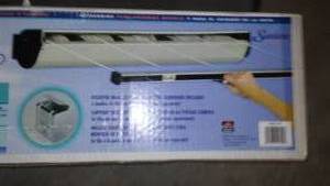 lot 325 image: Retractable Clothesline. New In Box