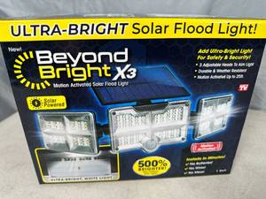 lot 228 image: New Beyond Bright X3 Motion Activated Solar Powered Flood Light