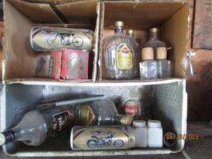 lot 41 image: Empty Crown Royal bottle and mini b...