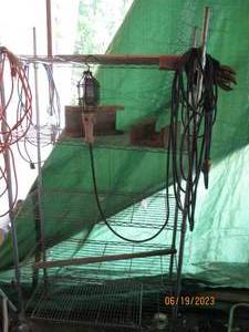 lot 49 image: Metal shelf, extension cords, utili...