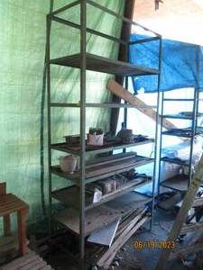 lot 53 image: 8 tier metal shelf and everything o...