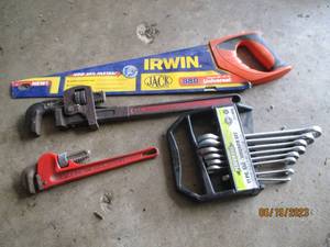 lot 63 image: Hand saw and wrenches...
