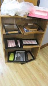 lot 58 image: Bookshelf with an assortment of picture frames