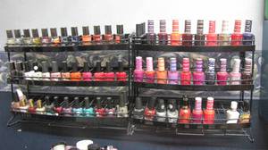lot 83 image: Wall mounted salon display with all contents