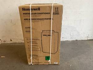 lot 6 image: Honeywell 11,000 BTU  50 Pint White Portable Air Conditioner and Dehumidifier with Fan, Drain Pan, and Insulation Tape