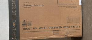 lot 68 image: Delta Children Essex Bianca White with Natural Legs 4-in-1 Convertible Baby Crib
