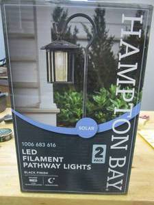 lot 438 image: Hampton Bay Grantville Solar 15 Lumens Black Outdoor Integrated LED Shepherd Hook Path Light (2-Pack) WeatherWaterRust Resistant (OPEN BOX)
