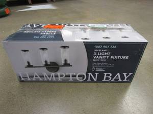 lot 448 image: Hampton Bay Loveland 16.625 in. 3-Light Black Vanity Light Fixture for Bathroom with Clear Glass Shades (OPEN BOX)