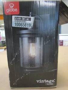 lot 618 image: Globe Electric Xavier Matte Black Farmhouse IndoorOutdoor 1-Light Wall Sconce with Seeded Glass Shade (OPEN BOX)