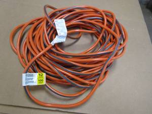 lot 656 image: Ridgid 12 Gauge 100 ft Extension Cord in Orange & Gray (OUT OF PACKAGING)