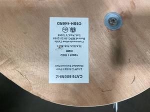 lot 52 image: Spool and box of Cat 6 600mhz Wire