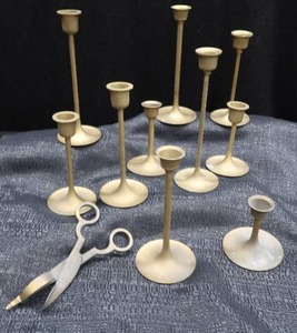 lot 68 image: LOT OF 10  VINTAGE GRADUATING BRASS CANDLE STICKS AND A VINTAGE WICK TRIMMER