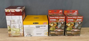 lot 119 image: NEW Kitchen Accessories Crofton Glass Pitcher, Bella Electric Gravy Boat Warmer, and  Stonewave Microwave Cooker (2) K