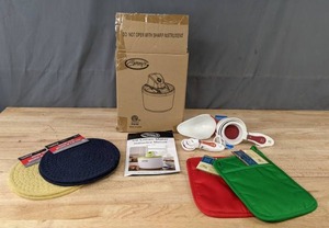lot 100 image: NEW Ginnys Ice Cream Maker, Woven Trivets, Measuring Cups, and More Kitchen Items K